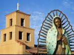 Mary Of Guadalupe in front of Sanctuary Of Guadalupe, Santa Fe, New Mexico.