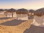 Tiki Huts and Massage Tents on Beach.