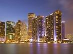City of Miami Florida, colorful night panorama of downtown business and residential buildings.