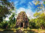 Ancient Khmer pre Angkor architecture. Sambor Prei Kuk temple ruins with giant banyan trees under blue sky. Kampong Thom, Cambodia travel destinations