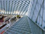 It is the main lobby of Seattle Central library. The unique glass walls and roofs are for good natural daylight. It is a very environmental building.