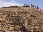 Group of tourists decends the Huaca Pucllana pyramid